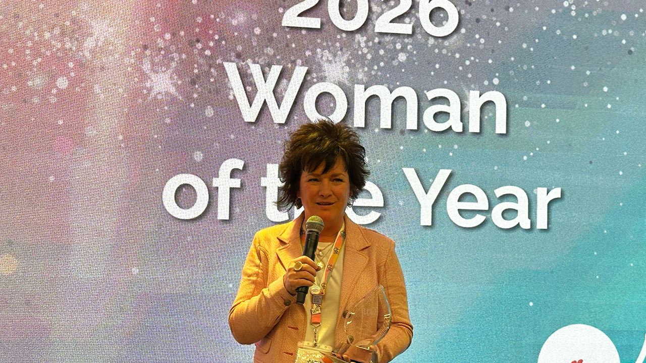 Jennye Scott receives an award recognizing her as Women of Flexo’s Woman of the Year.