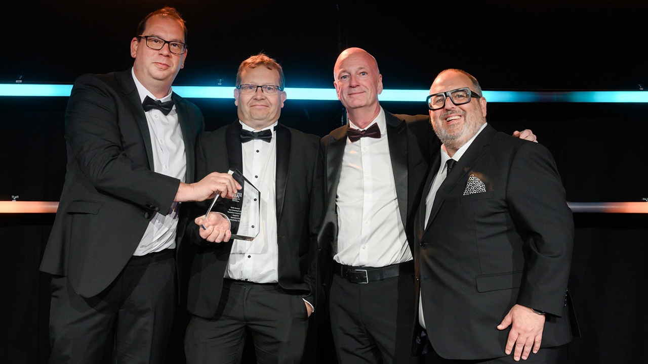 L to R: eProductivity Software representative; Rob Deighton, Sun Chemical; Mark Frost, Sun Chemical; Justin Moorhouse, comedian and host of the awards dinner.