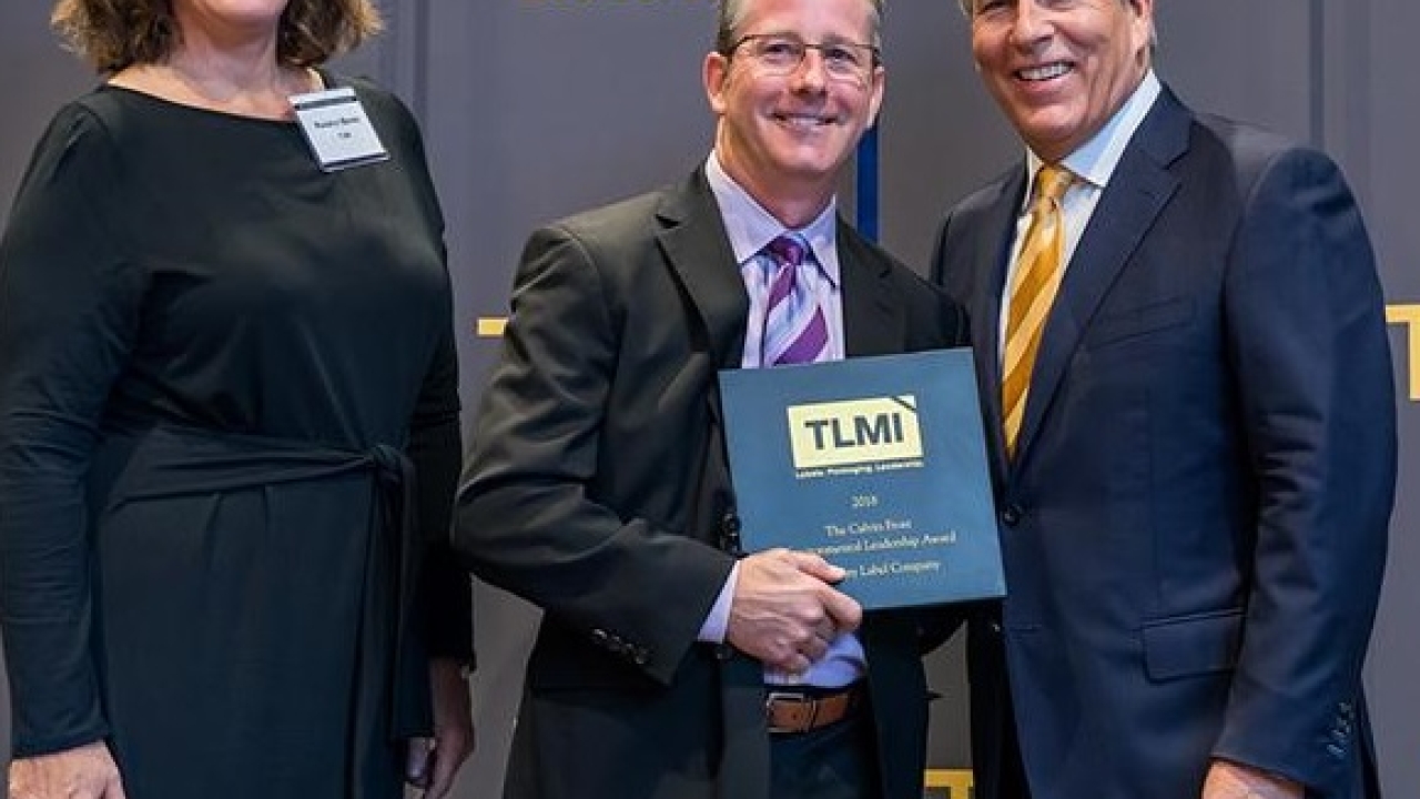 Rosalyn Bandy, TLMI Director of Environmental Strategies and Outreach, Scott Pillsbury, President, Rose City Label, and Craig Moreland, TLMI Chairman. Rose City Label honored with an enviromental award at the TLMI Annual Meeting